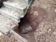 septic lid under stairs